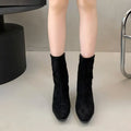 Women's brown square toe ankle boots with a side zipper and a mid kitten heel on a waterproof platform.