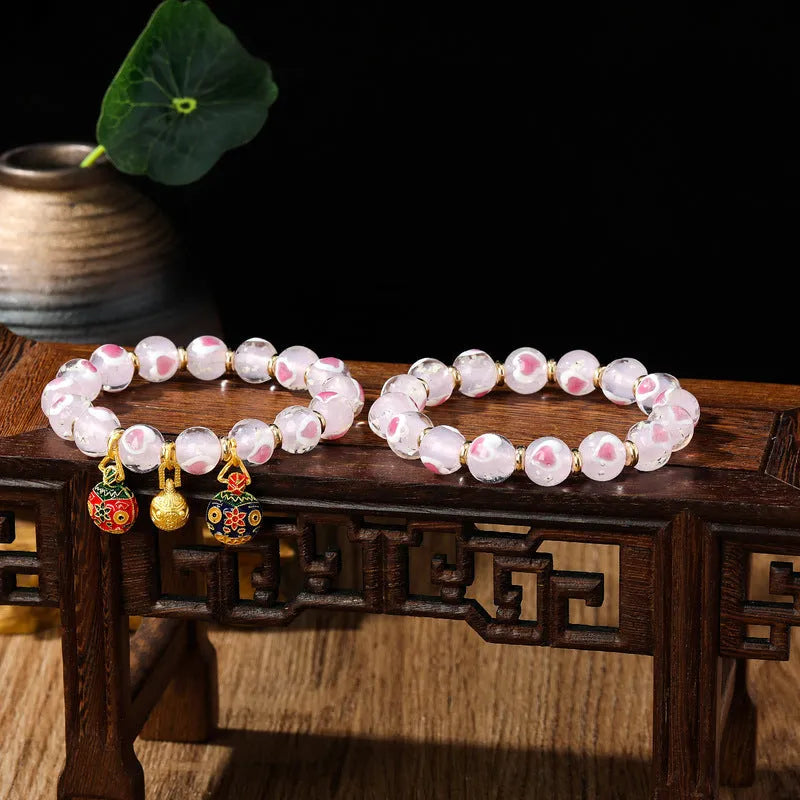 Handmade fluorescent glaze bracelet with swallowing gold beast motif on heart-shaped 10mm beads