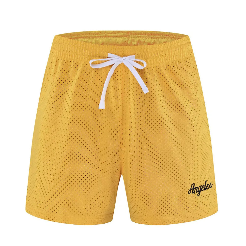 Men's black double-layer mesh sport shorts laid flat, showing mesh panelling and elasticated waistband.