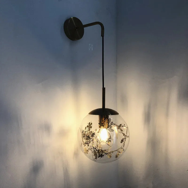 Modern glass wall lamp in golden flower or silver flower finish, shown in 15cm and 20cm sizes.