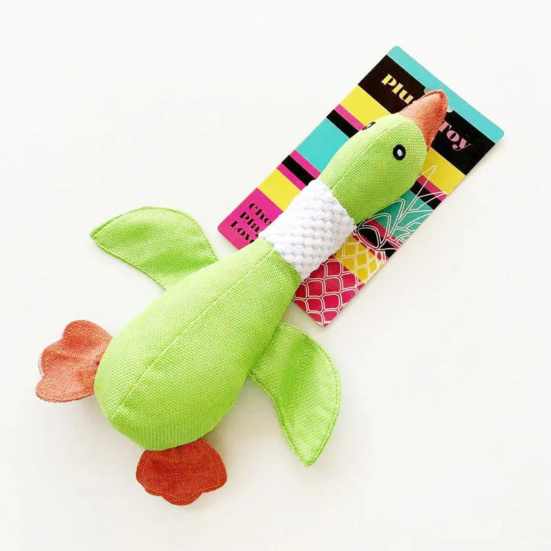 Blue duck-shaped plush dog toy with squeakers for chewing and interactive play