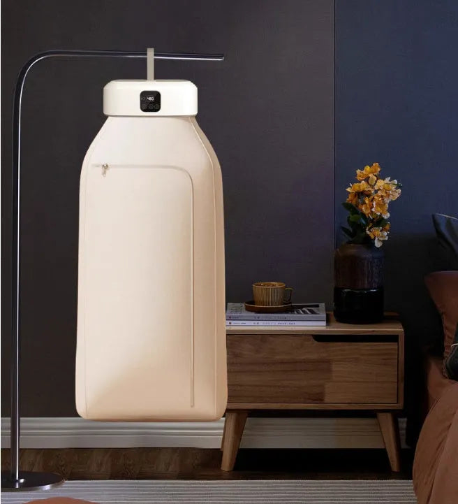 White cylindrical foldable laundry dryer with remote control for dormitory and small space use.