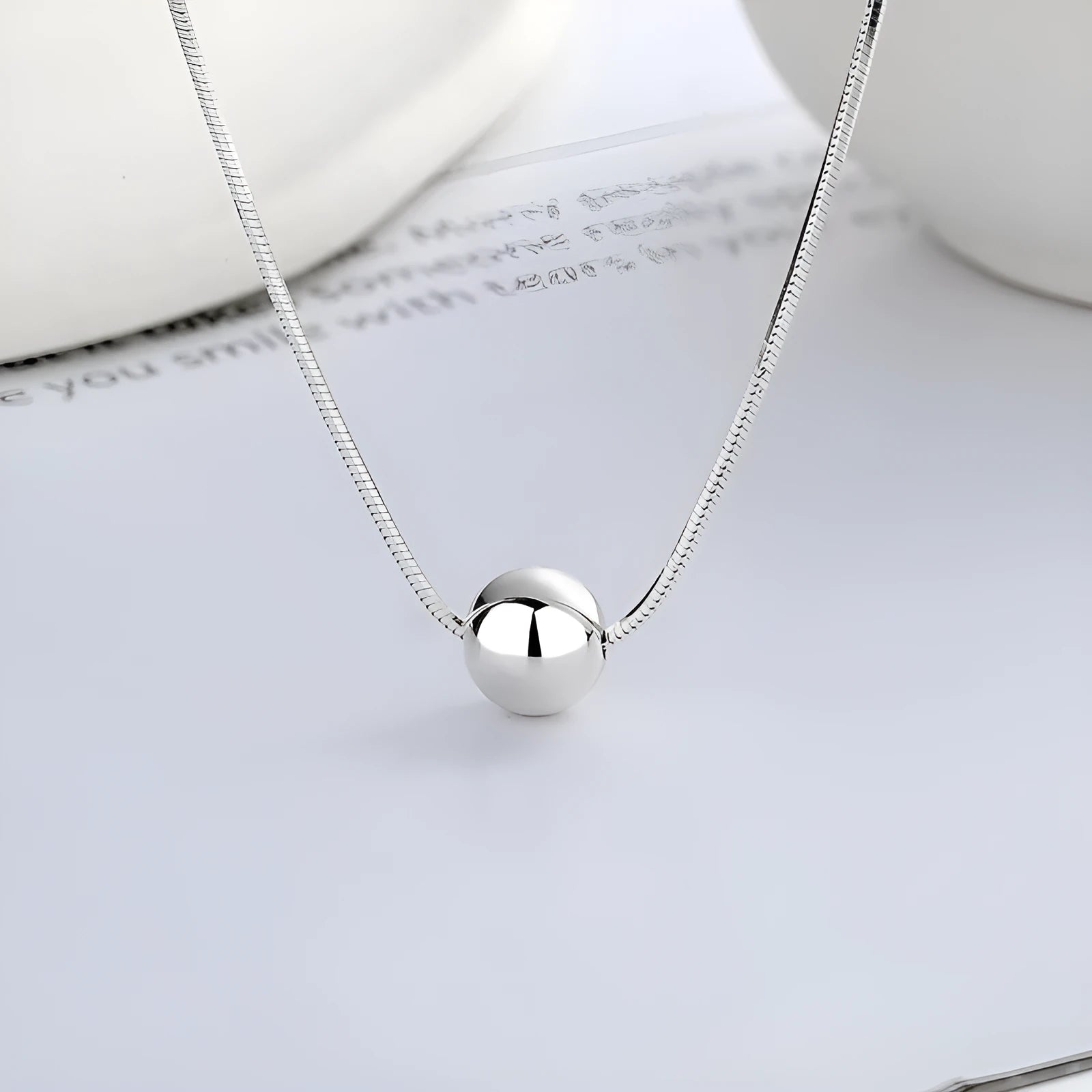 Sterling silver clavicle chain necklace with small ball pendant on delicate chain