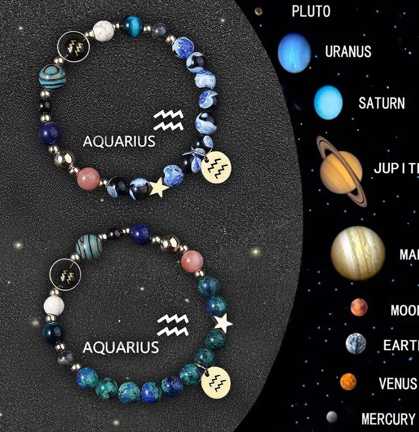 Set of two natural stone beaded bracelets with zodiac sign charms on a white background.
