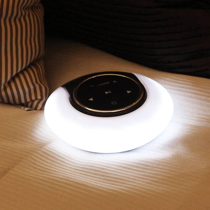 Blue Bluetooth desk lamp speaker with folding design and touch controls showing LED lighting