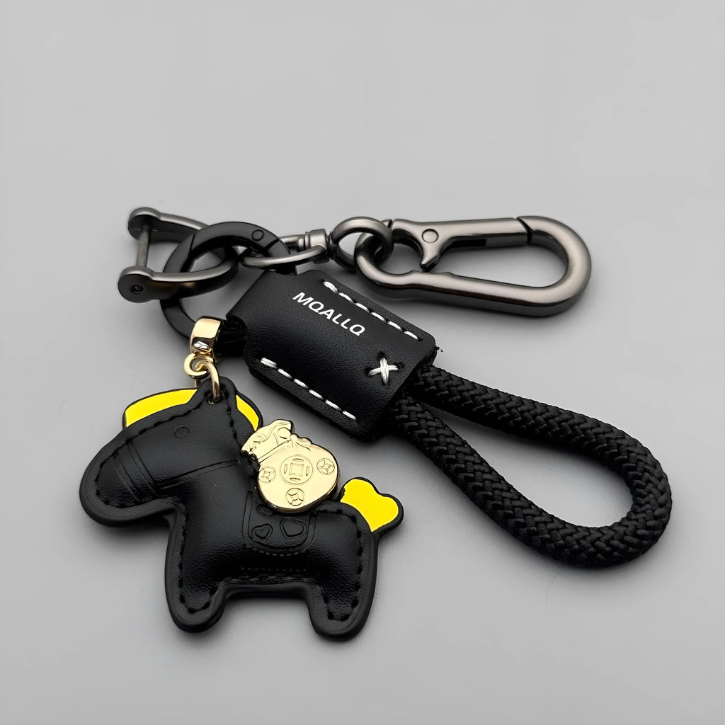 Handmade cowhide car key ring pendant with zinc alloy pony belt buckle charm and flanelle rope in various colours.