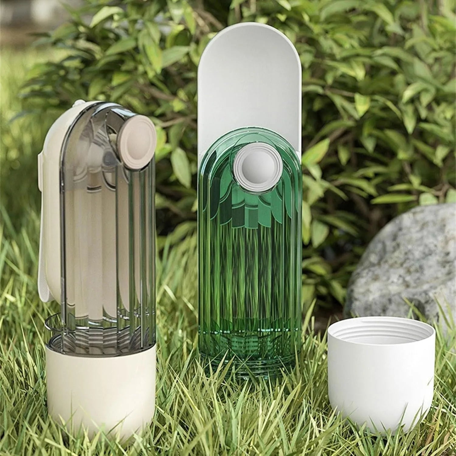 Beige dog water bottle with foldable silicone tray and integrated food dispenser base.