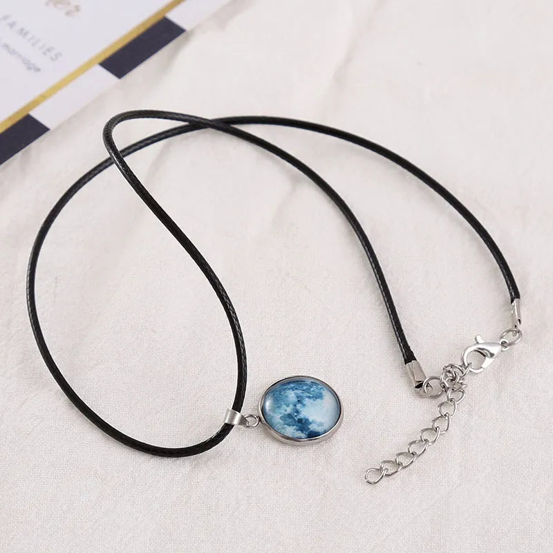 Luminous glass and coloured glaze constellation pendant necklace on an alloy chain with extension.