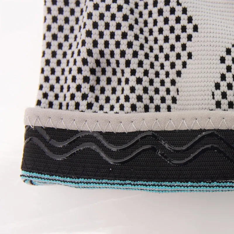 Sky blue elastic fibre knee pads with silicone grip for sports like basketball and running.