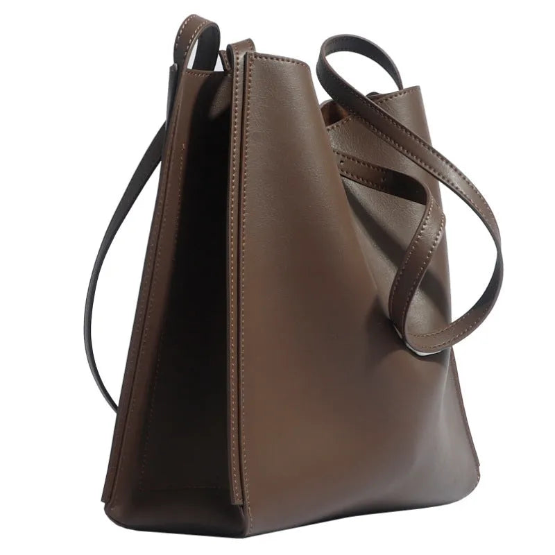 Brown genuine leather women's bucket bag with double shoulder straps and multiple internal organisers