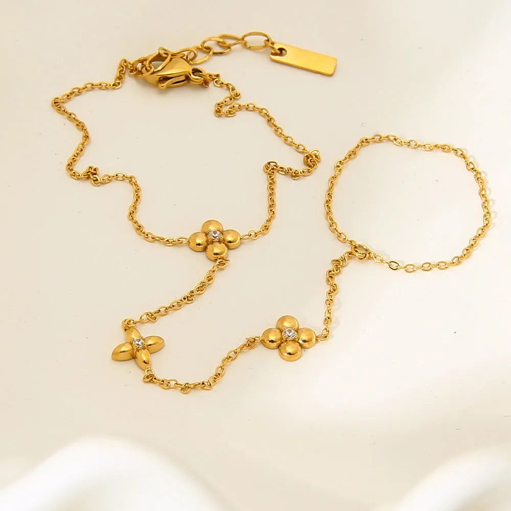Gold-colour stainless steel women's bracelet with geometric flower and eight-pointed star design