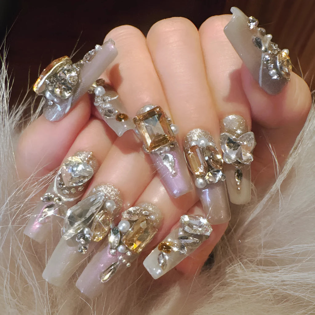 Rhinestone embellished false nail patches in heavy industry luxury designs with card packaging