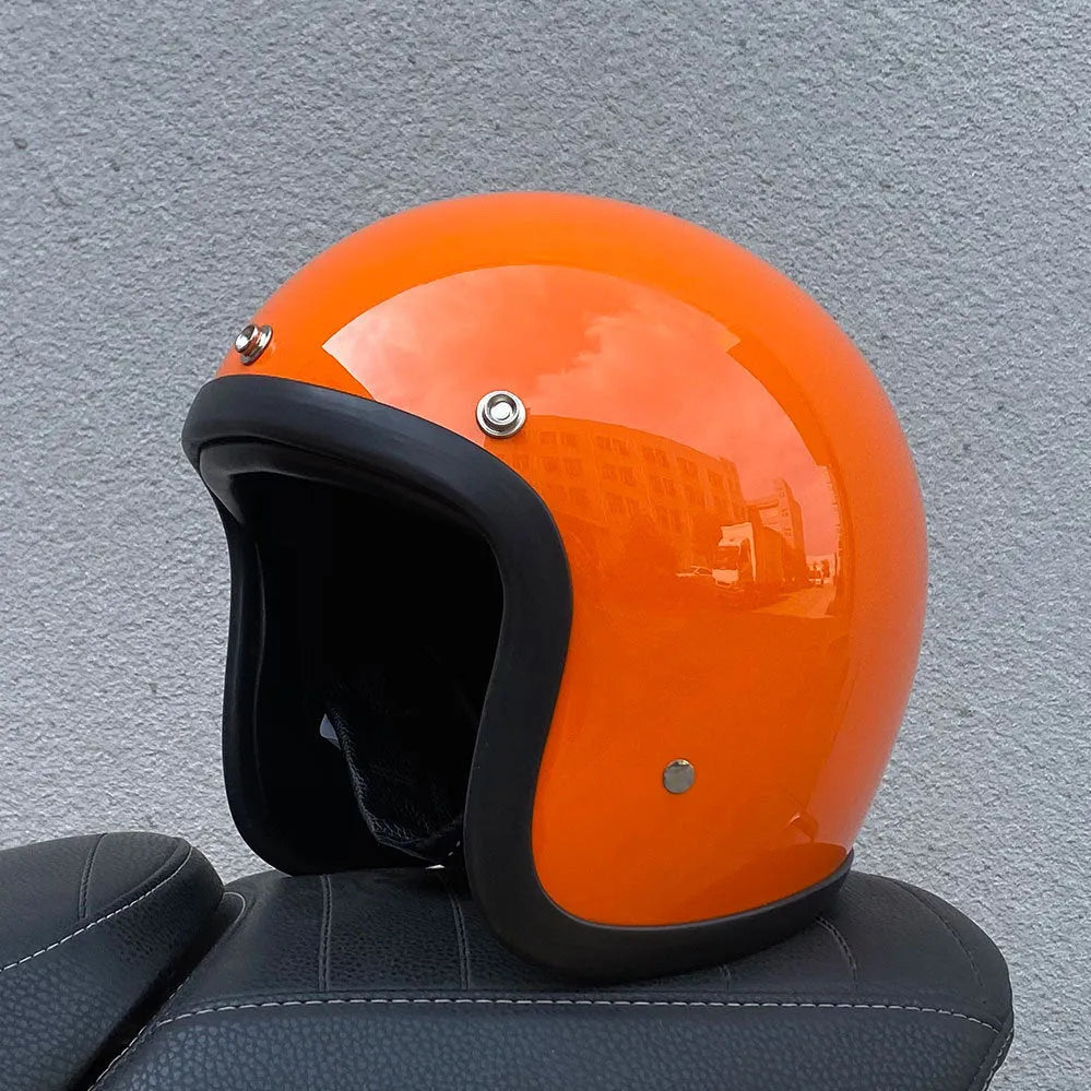 Retro-style open-face motorcycle half helmet in fibreglass, shown in a cement grey colour on a white background.