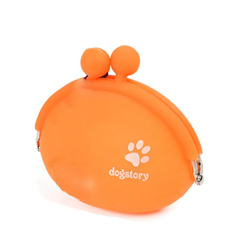 Yellow silicone dog training treat pouch with hook-and-loop closure, shown clipped to a waistband.