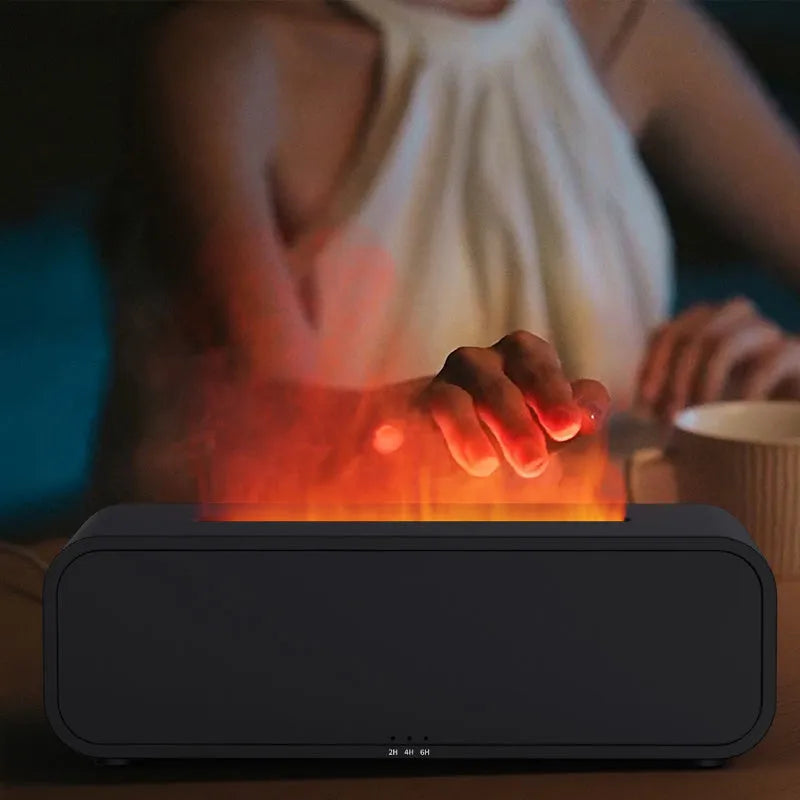 Black and white flame dynamic aroma diffuser with remote control on a wooden table