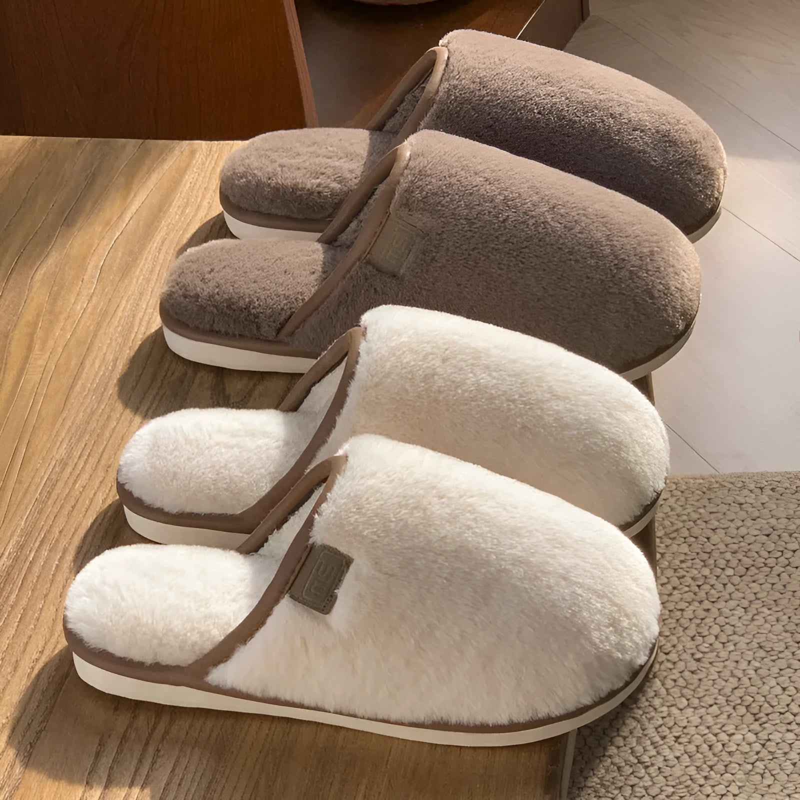Blue winter plush slippers with non-slip PVC soles on a wooden floor.