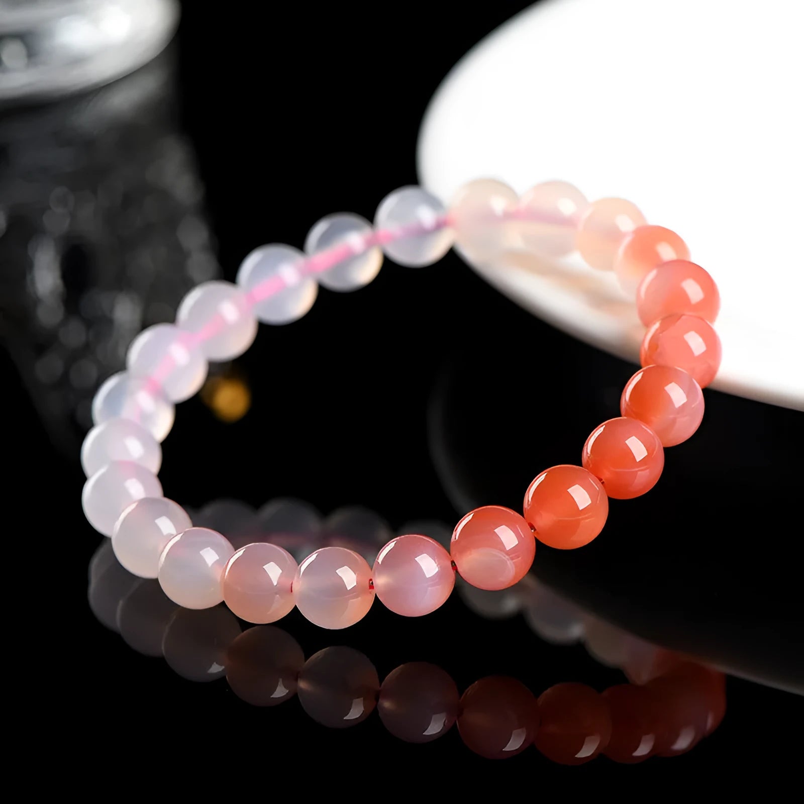 Yanyuan Agate bracelet with gradient salt source colour on wrist, showing geometry-shaped beads.