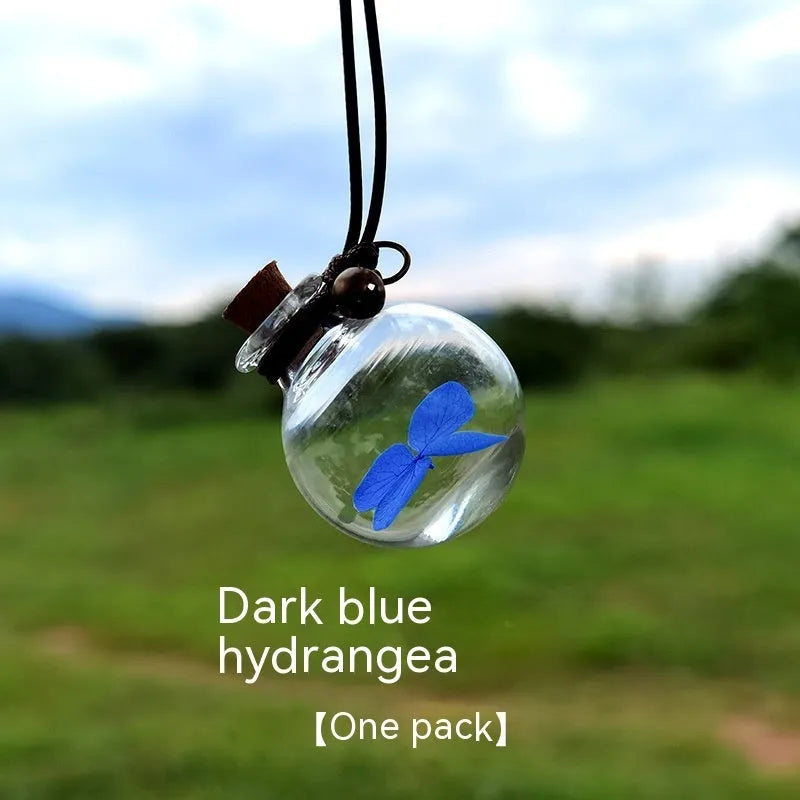 Glass car perfume pendant with preserved flowers in selected colour and diameter