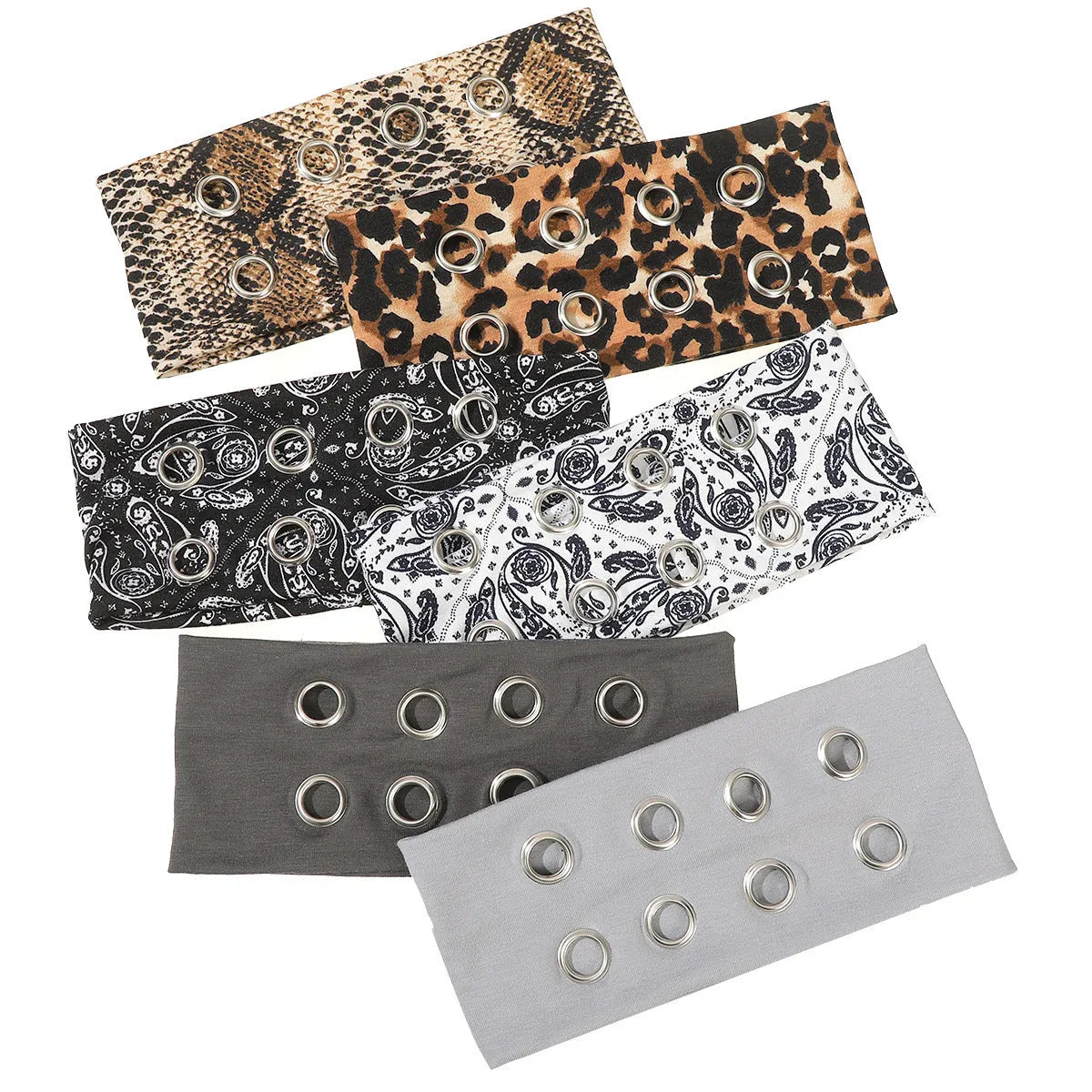 A black polyester exercise hair band with a hollow metal decorative centrepiece.