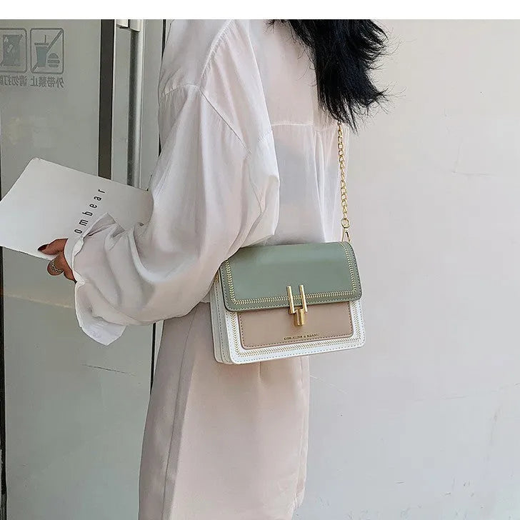 Women's wide strap crossbody bag in Matcha Green PU material with contrast colour details for leisure travel