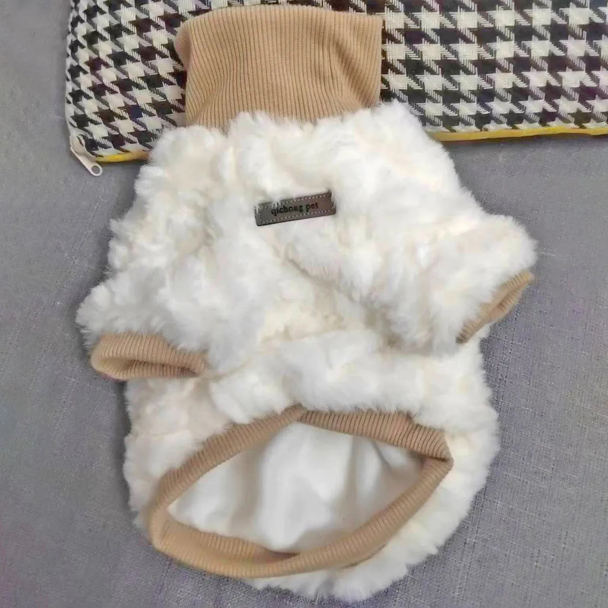 Creamy green turtleneck plush dog coat on small breed with detailed sizing chart showing chest and back measurements.