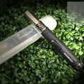 Black portable flamethrower with child lock for outdoor camping and BBQ use