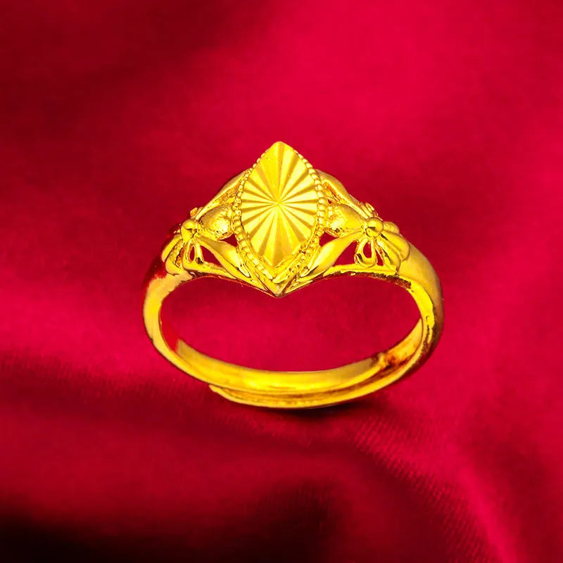 Gold-coloured geometric flower ring with textured surface and open design on brass