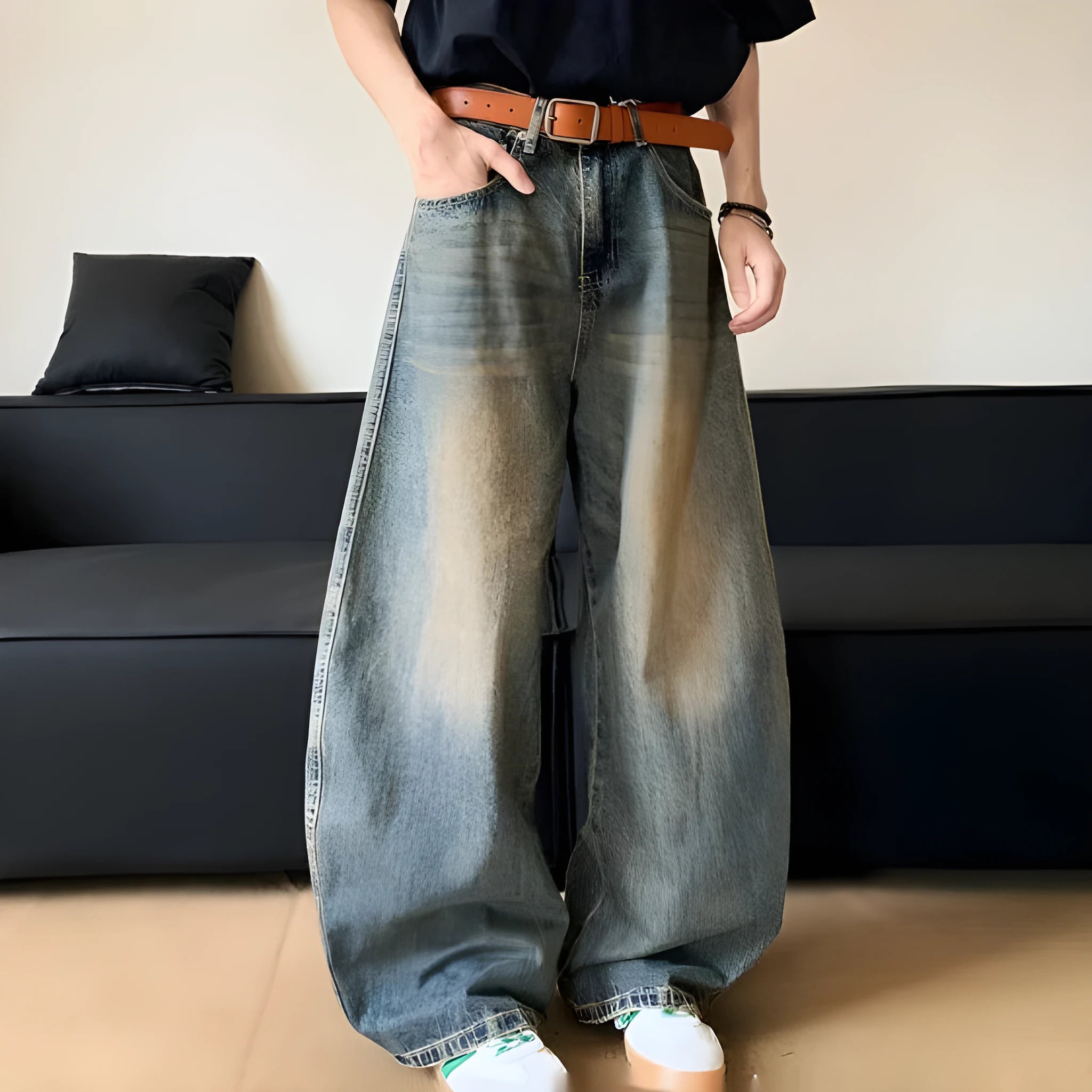 Men's retro blue distressed denim jeans with slim fit wide leg design showing machete wash detailing