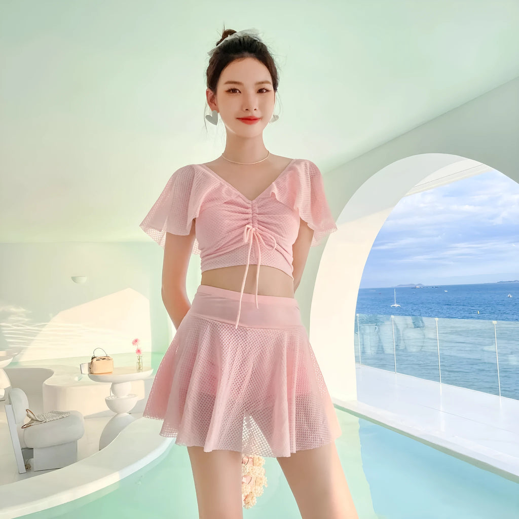Women's solid colour two-piece skirt swimsuit set in black, white, or pink with separate top