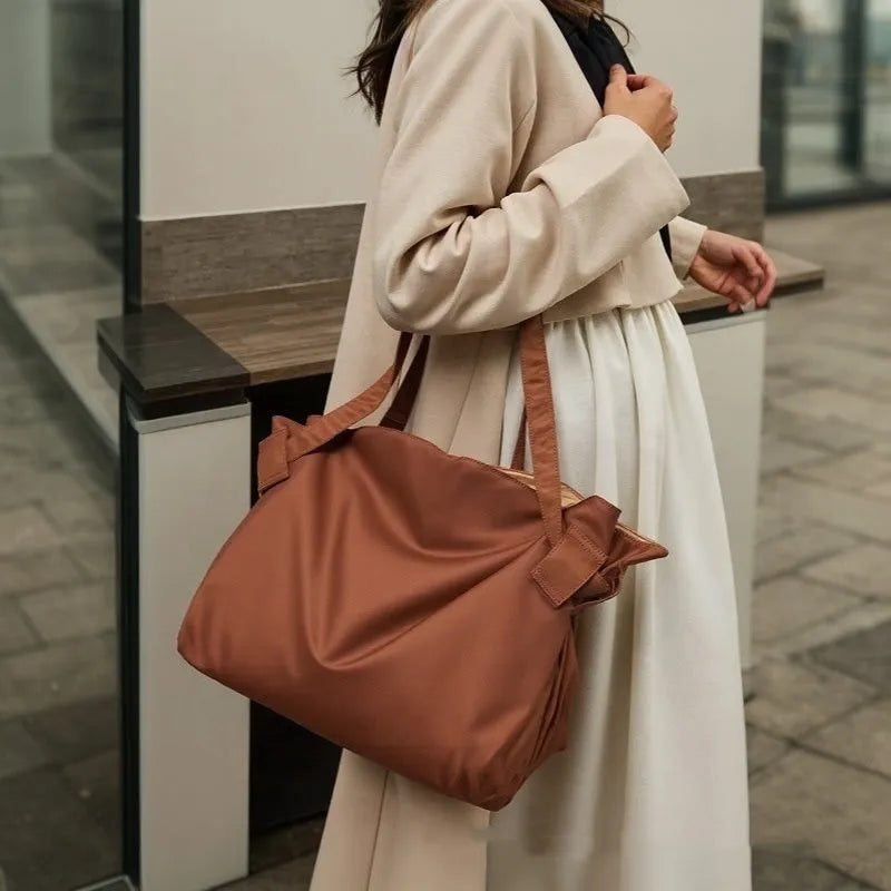 Women's Oxford cloth expandable shoulder crossbody bag in black or light brown for travel and daily storage