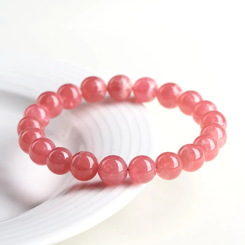 Women's geometric rhodochrosite crystal bracelet with longevity lock clasp in natural red patterned stone
