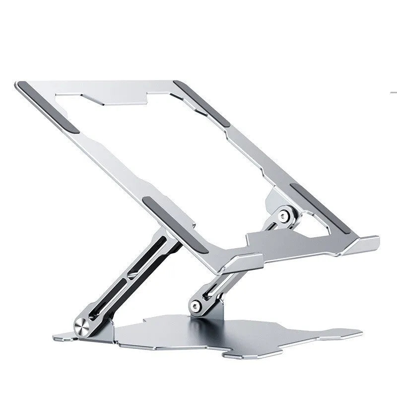 Grey portable aluminum laptop stand shown folded and in use with a silver laptop, demonstrating its adjustable angle.