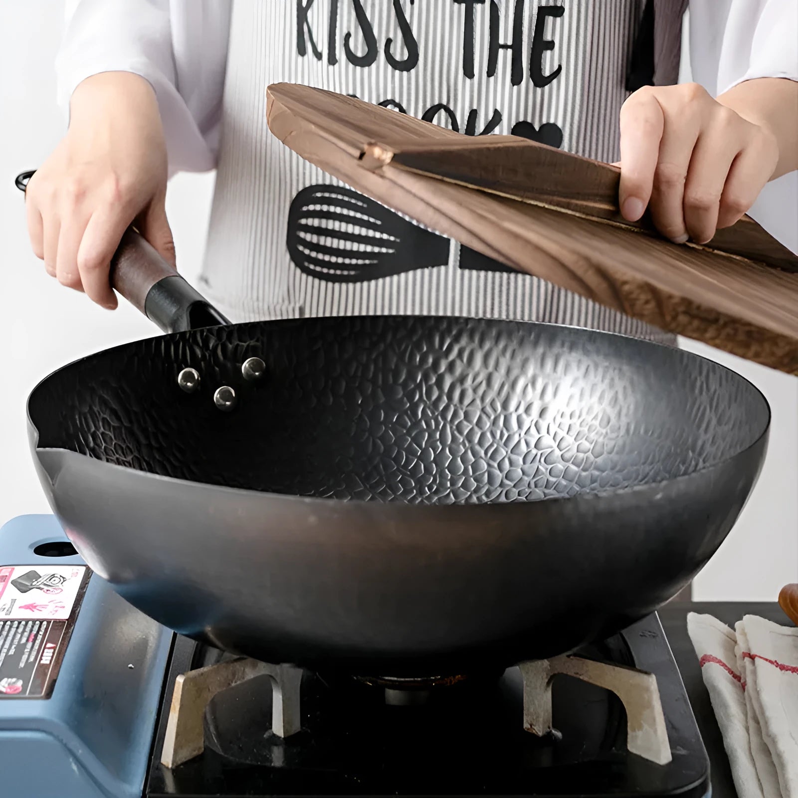 Traditional black iron wok with wooden handle showing 40cm diameter cooking surface
