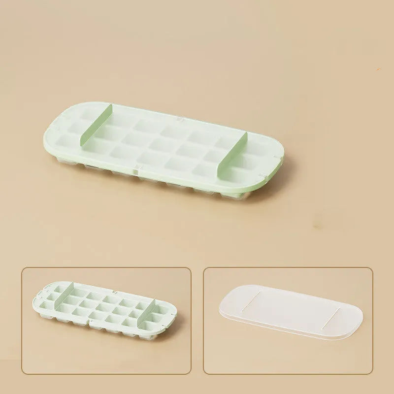 Yellow high-capacity ice cube tray with leverage handle and stored ice shovel.
