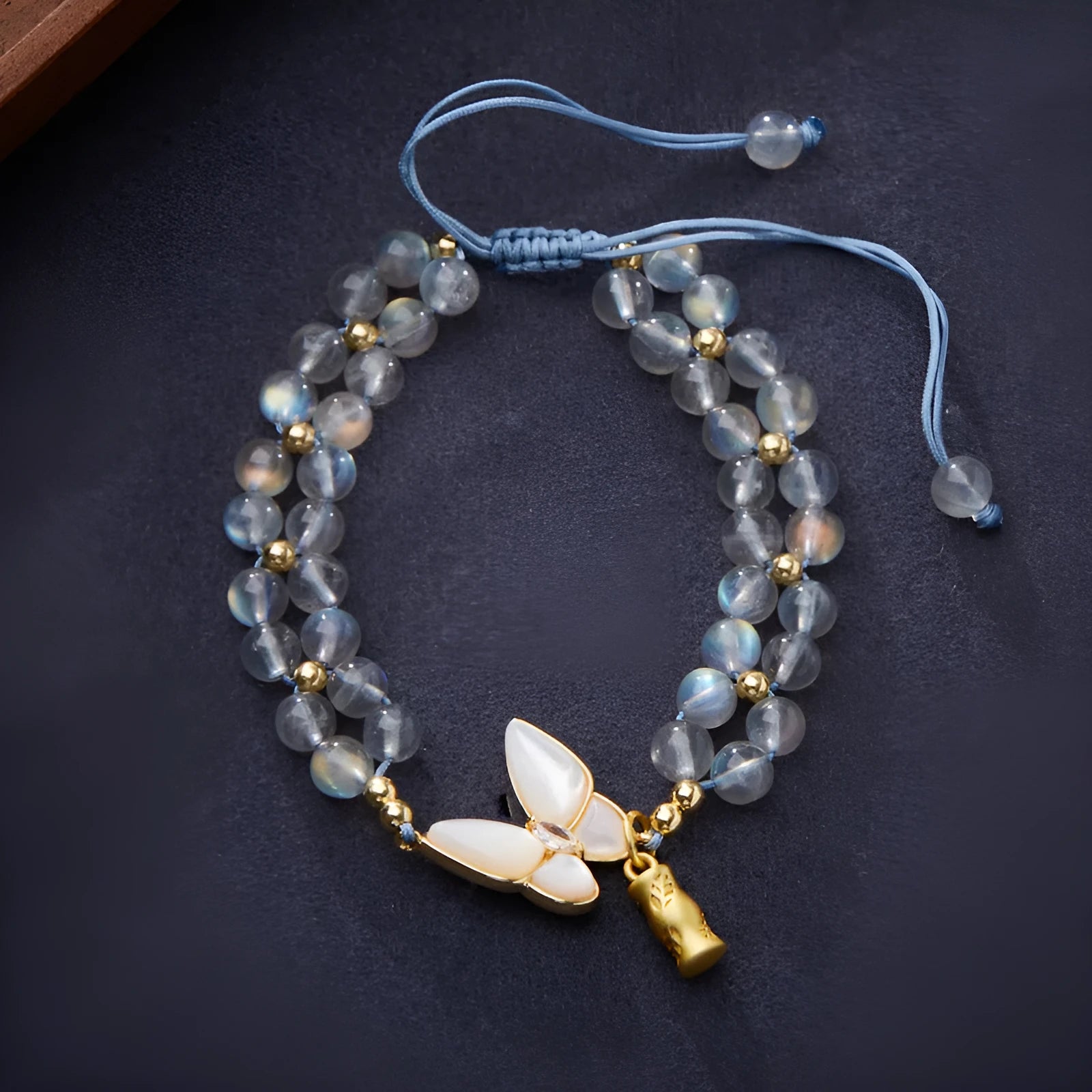 Grey moonstone butterfly charm woven bracelet for women with geometric retro design