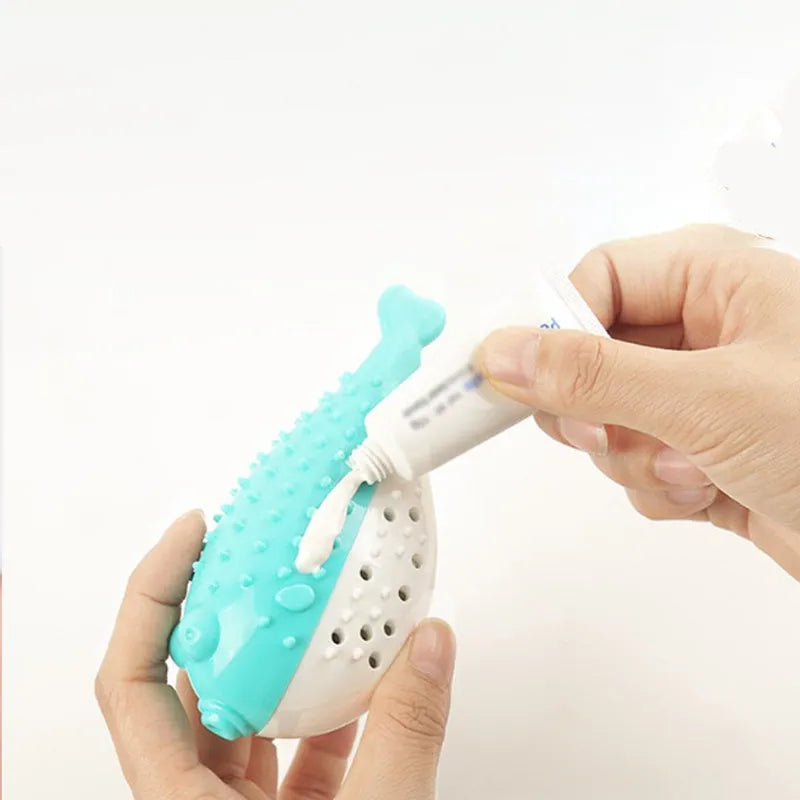 Small blue silicone fish-shaped chew toy for cats on a white background.