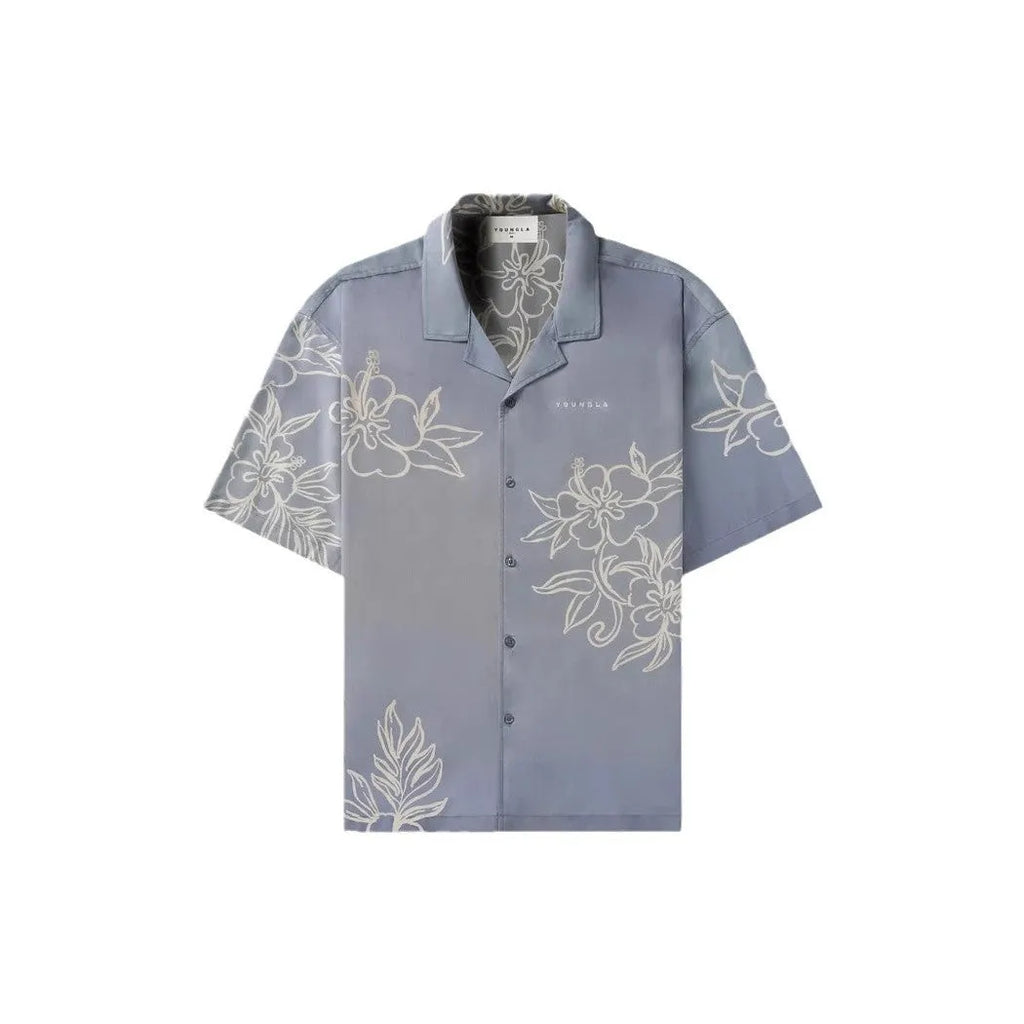 Man wearing a loose, short-sleeve floral print casual top in a cardigan style.