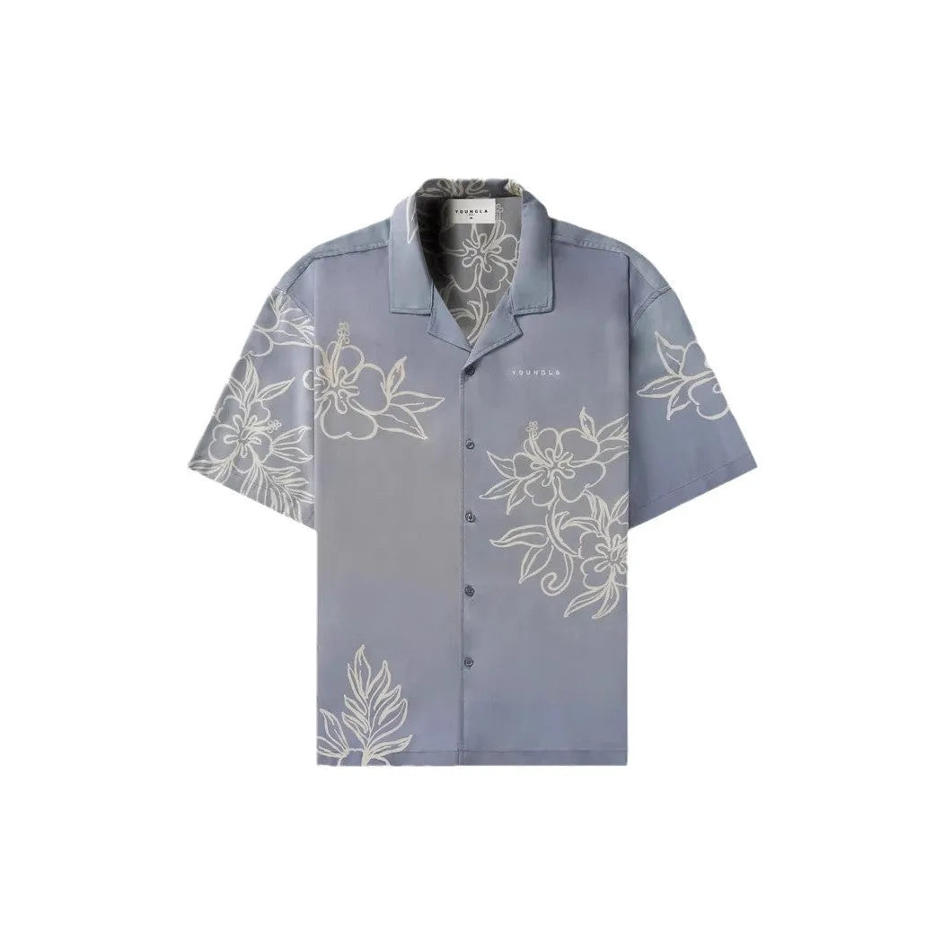 Man wearing a loose, short-sleeve floral print casual top in a cardigan style.