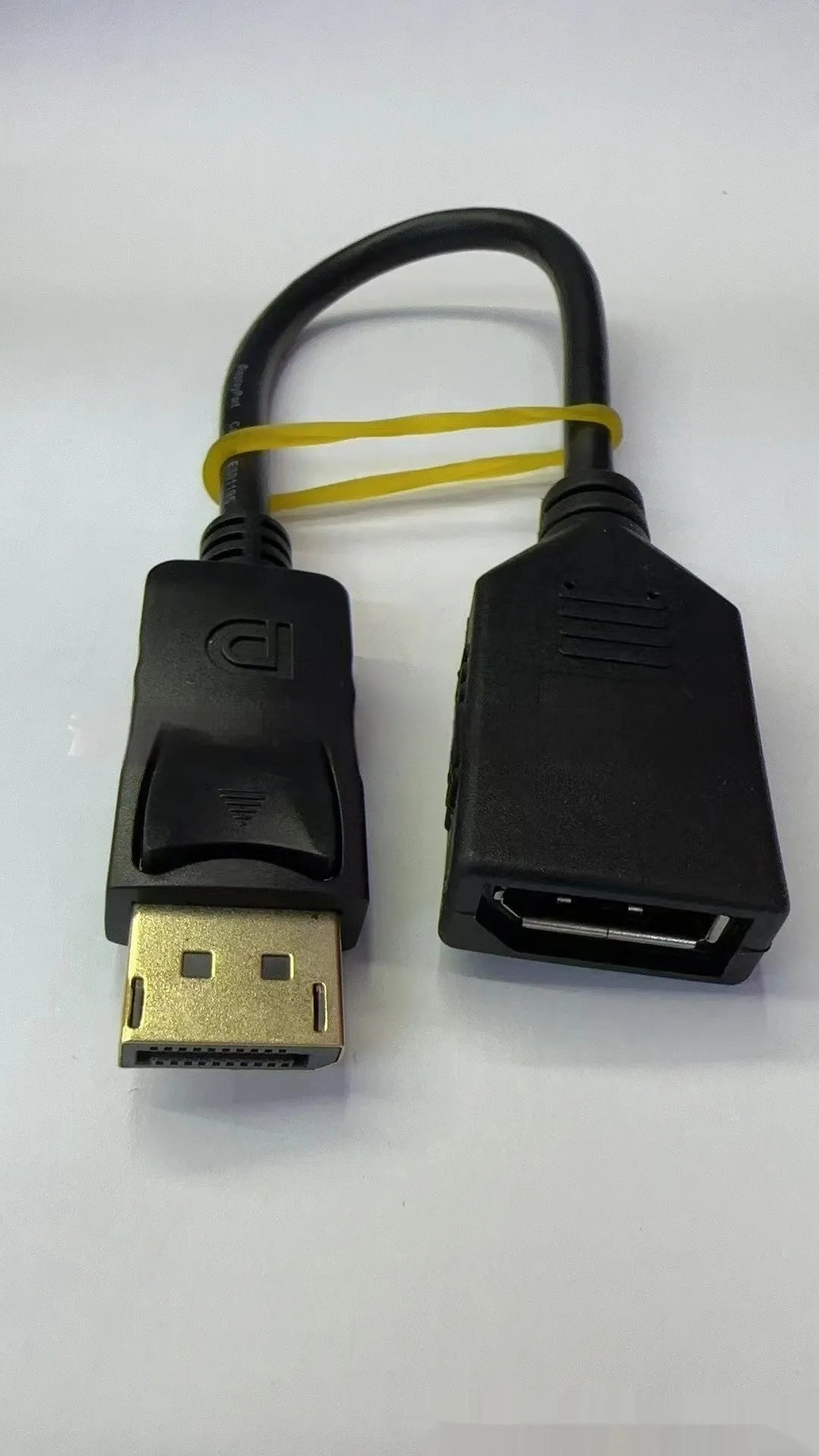 Black DisplayPort DP male to female extension cable with rotating connector, approximately 10cm long