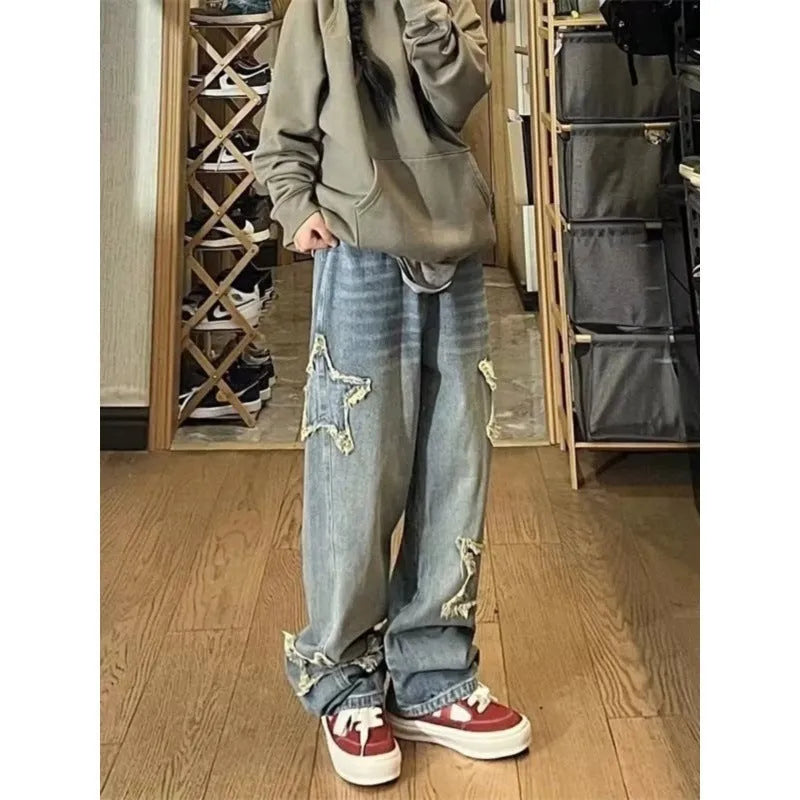 Blue high-waisted wide-leg cotton denim jeans laid flat.