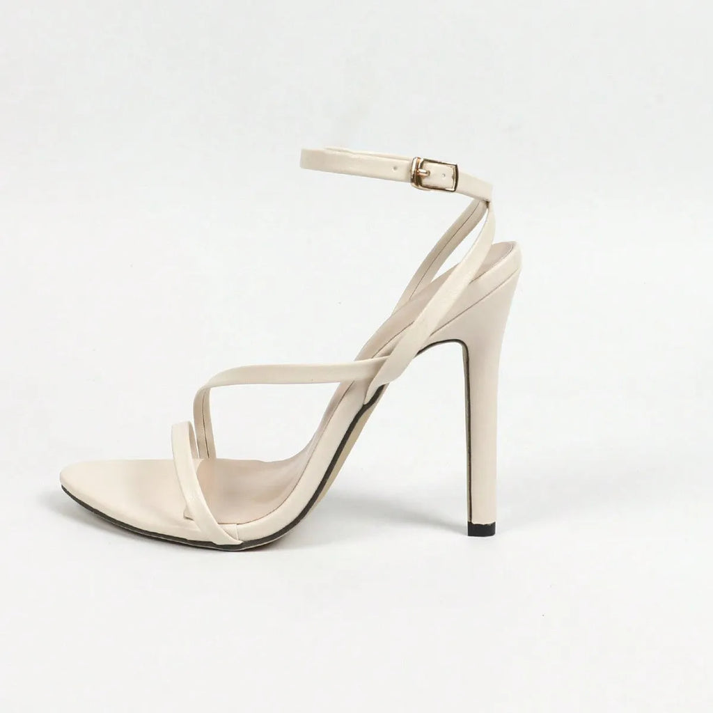 Women's gold high heel sandals with cross ankle straps and multi-stripe pattern