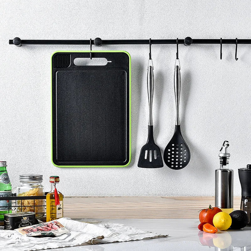 Grey square aluminium cutting board with integrated knife sharpener and grinding teeth