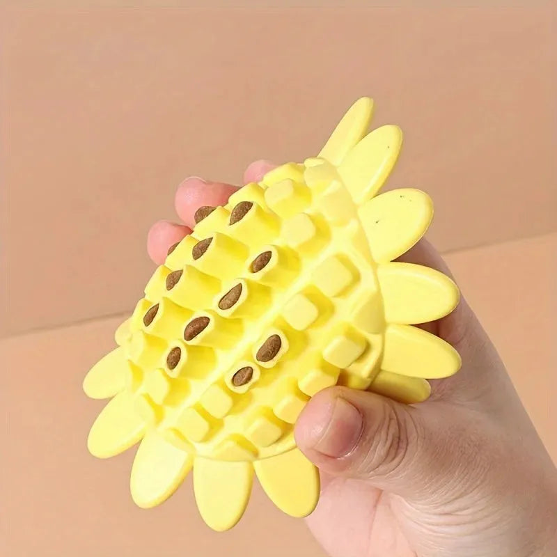 Yellow rubber sunflower-shaped dog chew toy measuring 7 cm across with textured petal surface