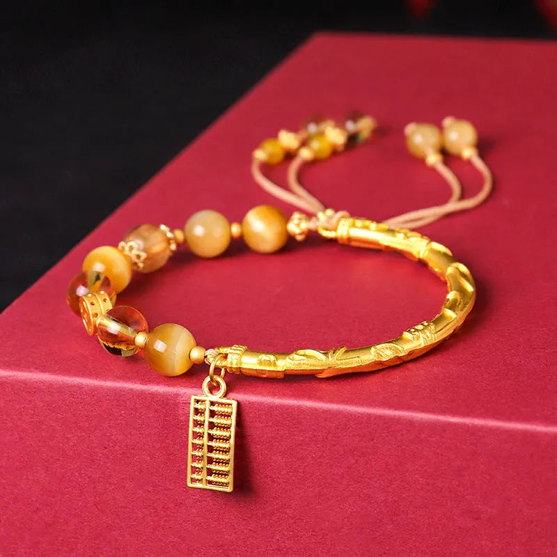 Women's tigereye and citrine abacus bracelet with diamond-shaped design and copper fastenings