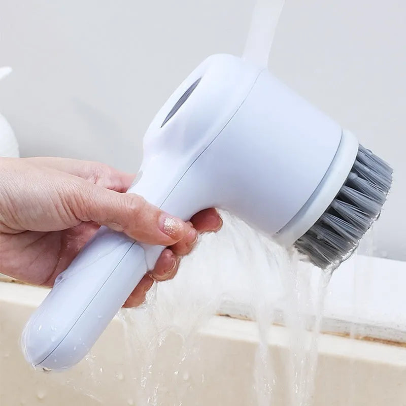 USB electric cleaning brush in light grey or purple with interchangeable cleaning heads for kitchen use