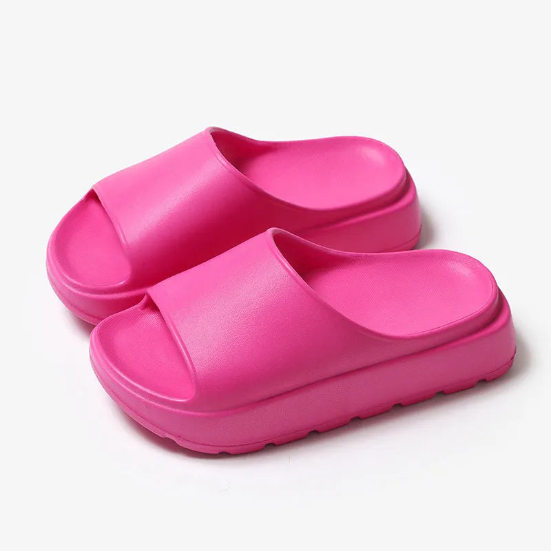 Women's thick-soled beige EVA beach slippers with a fish mouth design.
