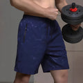 Men's loose fit polyester sports shorts in black, grey or blue colours with elastic waistband