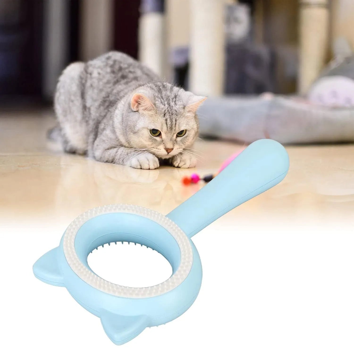 Blue and white double-sided pet grooming brush with comfortable handle for cats and dogs.