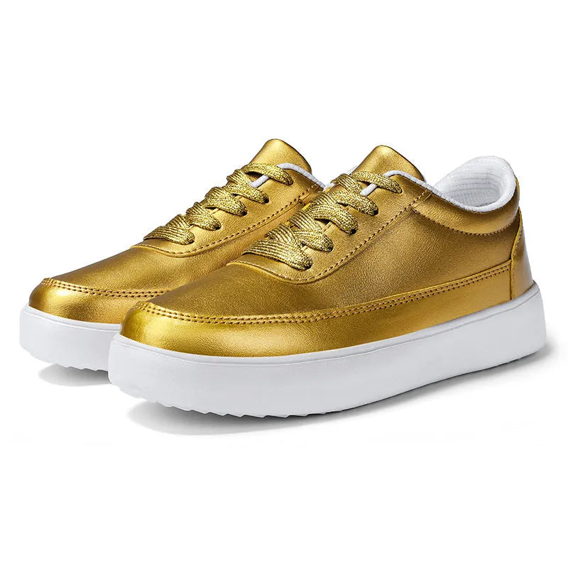 Women's white leather flat casual shoes with front lace-up design on a neutral background.