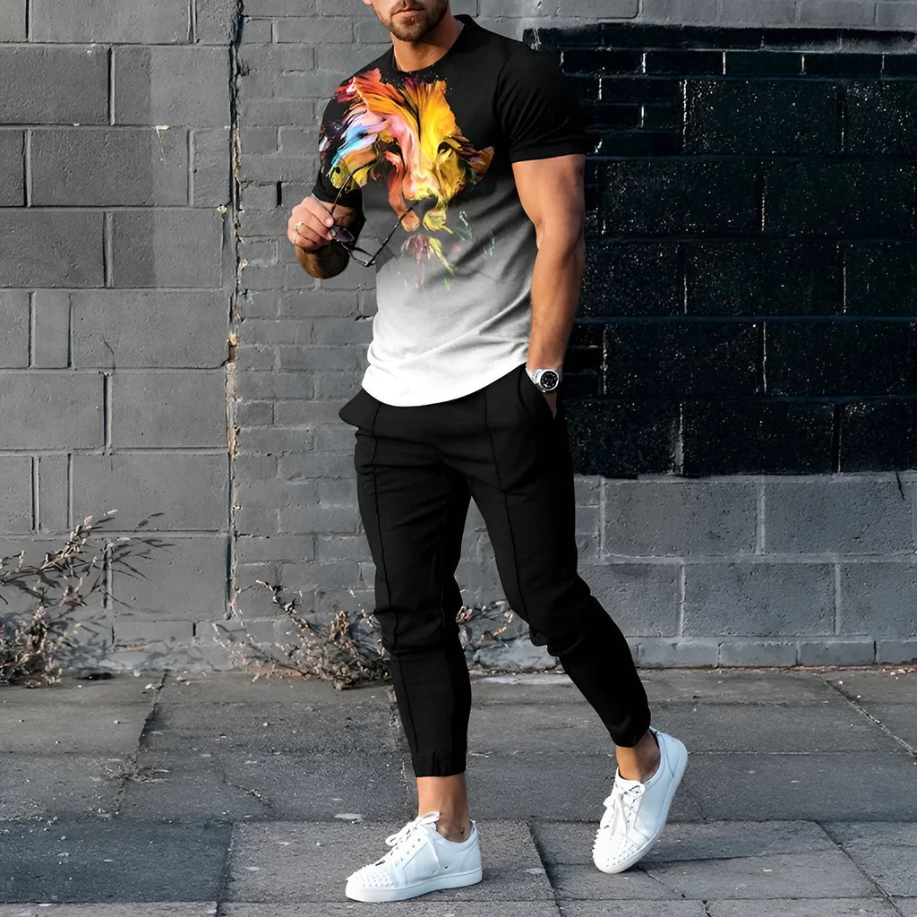 Man wearing a thin, short-sleeved printed pullover and matching trousers from a polyester blend sport suit set.